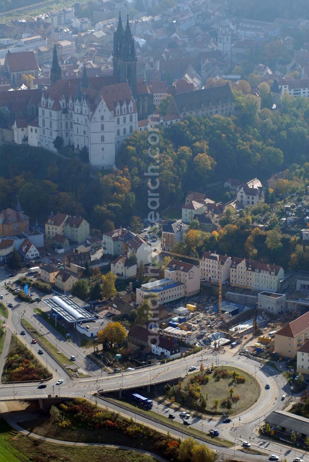 Aerial image Meißen - Blick auf die Bauarbeiten am 719 m langen Schottenbergtunnel durch die Ed. Züblin AG, Albstadtweg 3, 70567 Stuttgart - Tel.: 711 7883-0 Telefax: 711 7883-390 - E-Mail info@zueblin.de zur Umfahrung der Stadt Meißen an der Leipziger Straße. Im Hintergrund befindet sich die Albrechtsburg.