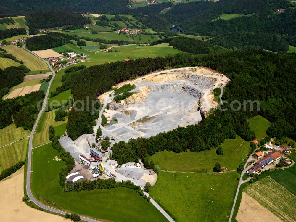 Schönberg from above - Gravel pit in the Saunstein part of Schoenberg in the state of Bavaria. The pit is located in the industrial area of Saunstein, in the North of the hamlet. The mining company Thiele Granit digs here for natural stones, flaggings and granite