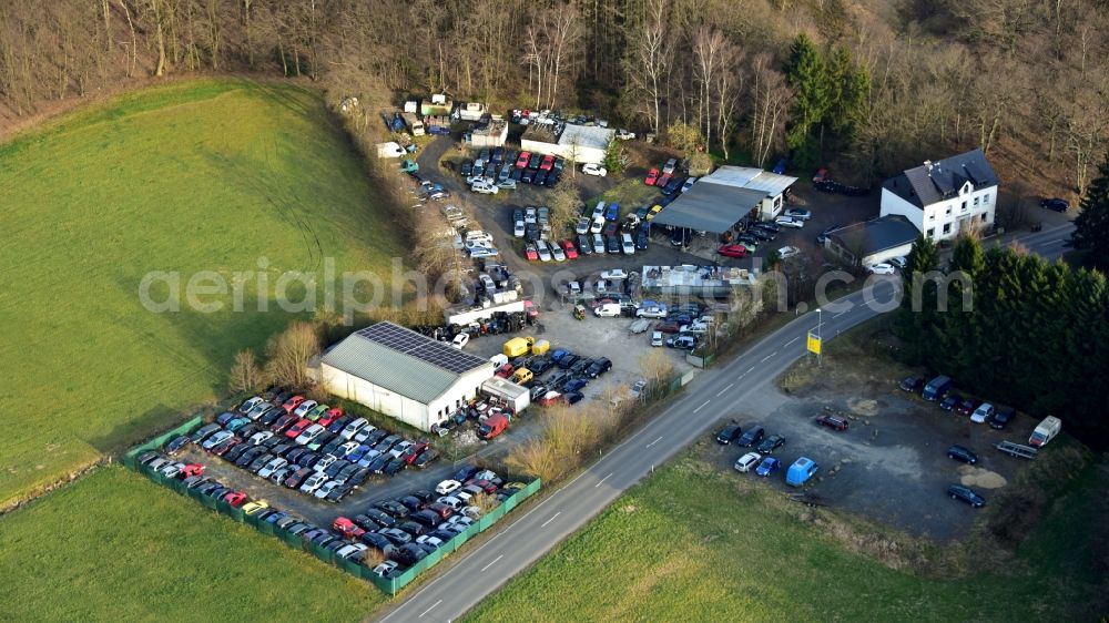 Krautscheid from the bird's eye view: Scrapyard for recycling of cars cars and used vehicles with decomposition and aftermarket Autoverwertung Becher on street Krautscheider Strasse in Krautscheid in the state Rhineland-Palatinate, Germany