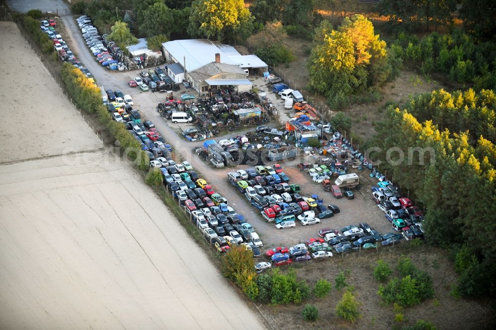 Ferbitz from the bird's eye view: Scrapyard for recycling of cars cars and used vehicles with decomposition and aftermarket in Ferbitz in the state Brandenburg, Germany