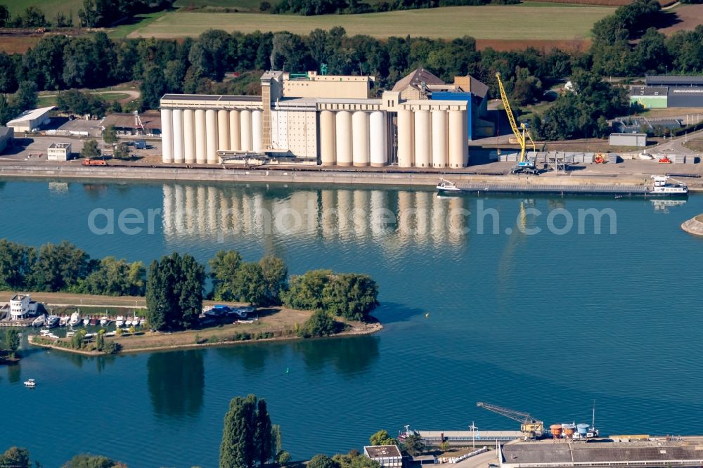 Biesheim from above - Wharves and jetties marine inland waterway with loading of building materials, earth, gravel, stones or other materials in the inner harbor in Biesheim in Grand Est, France