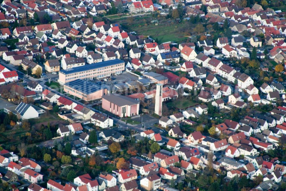 Aerial image Haßloch - School building of the Ernst-Reuter school and Tower and building of St. Ulrich church in Hassloch in the state Rhineland-Palatinate