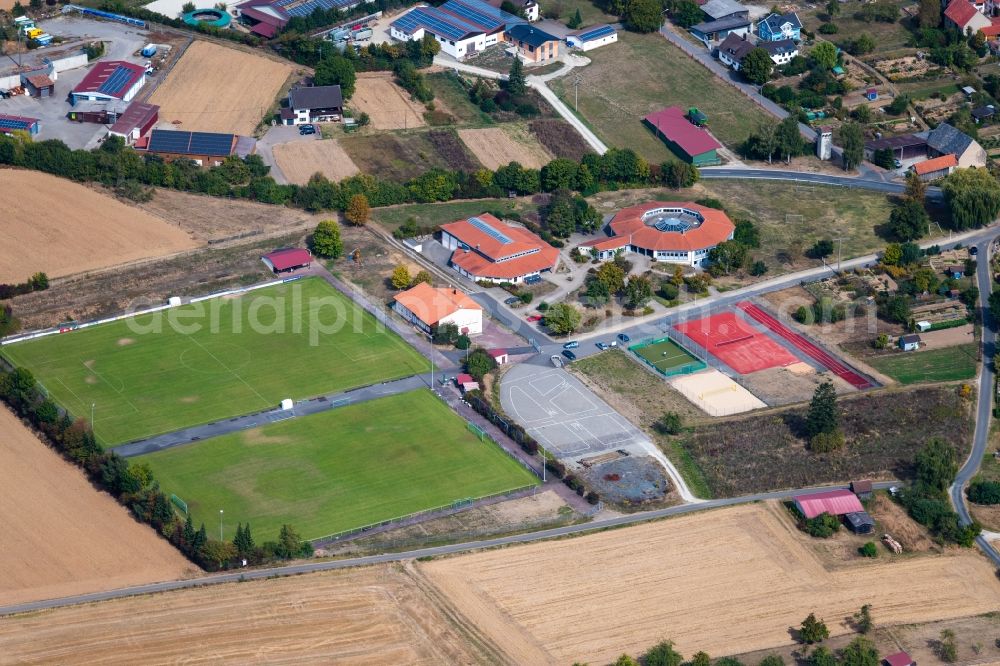 Aerial photograph Steinfeld - School building of the Grundschule Steinfeld overlooking the sports ground ensemble of SV Steinfeld 1931 e.V. on Waldzeller Strasse in Steinfeld in the state Bavaria, Germany