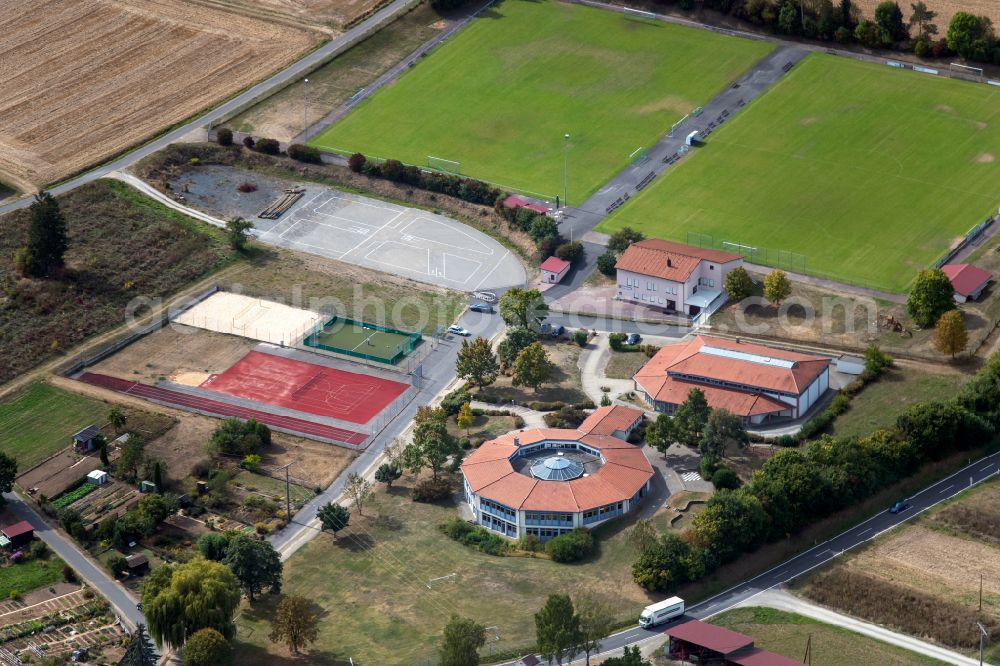 Steinfeld from above - School building of the Grundschule Steinfeld overlooking the sports ground ensemble of SV Steinfeld 1931 e.V. on Waldzeller Strasse in Steinfeld in the state Bavaria, Germany