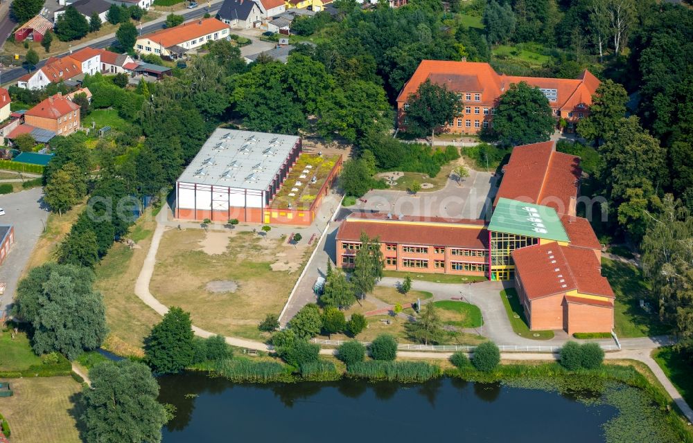 Burg Stargard from above - School building of the cooperative school on Muehlenteich pond in Burg Stargard in the state of Mecklenburg - Western Pomerania