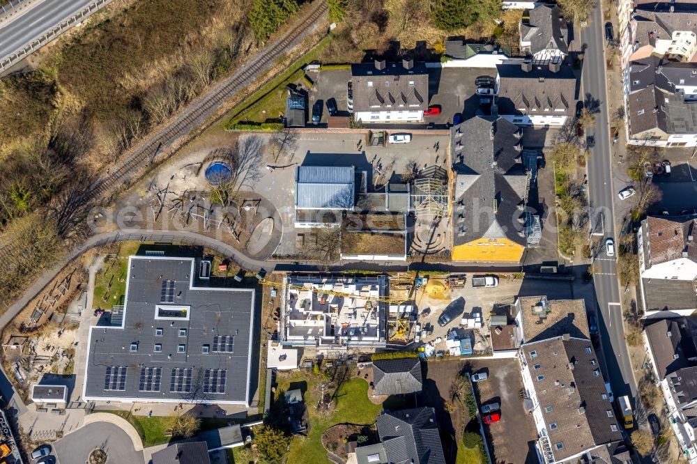 Aerial image Arnsberg - School building of the Roehrschule with a construction site on Marktstrasse in the district Huesten in Arnsberg at Sauerland in the state North Rhine-Westphalia, Germany