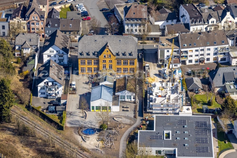 Arnsberg from above - School building of the Roehrschule with a construction site on Marktstrasse in the district Huesten in Arnsberg at Sauerland in the state North Rhine-Westphalia, Germany