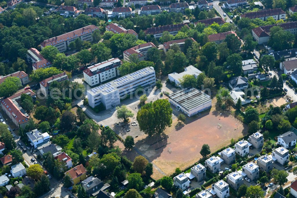 Berlin from above - School building and sports field Merian-Oberschule on street Mittelheide in the district Koepenick in Berlin, Germany