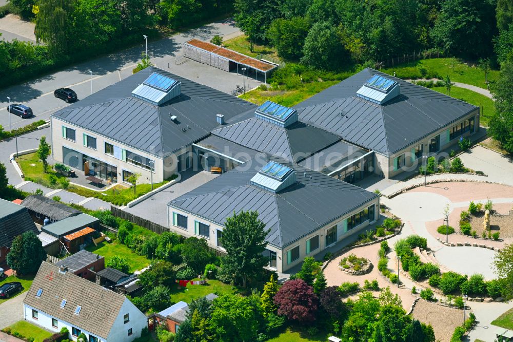 Ostenfeld from above - School building and sports field Otto-Thiesen-Schule on street Suederweg in Ostenfeld in the state Schleswig-Holstein, Germany