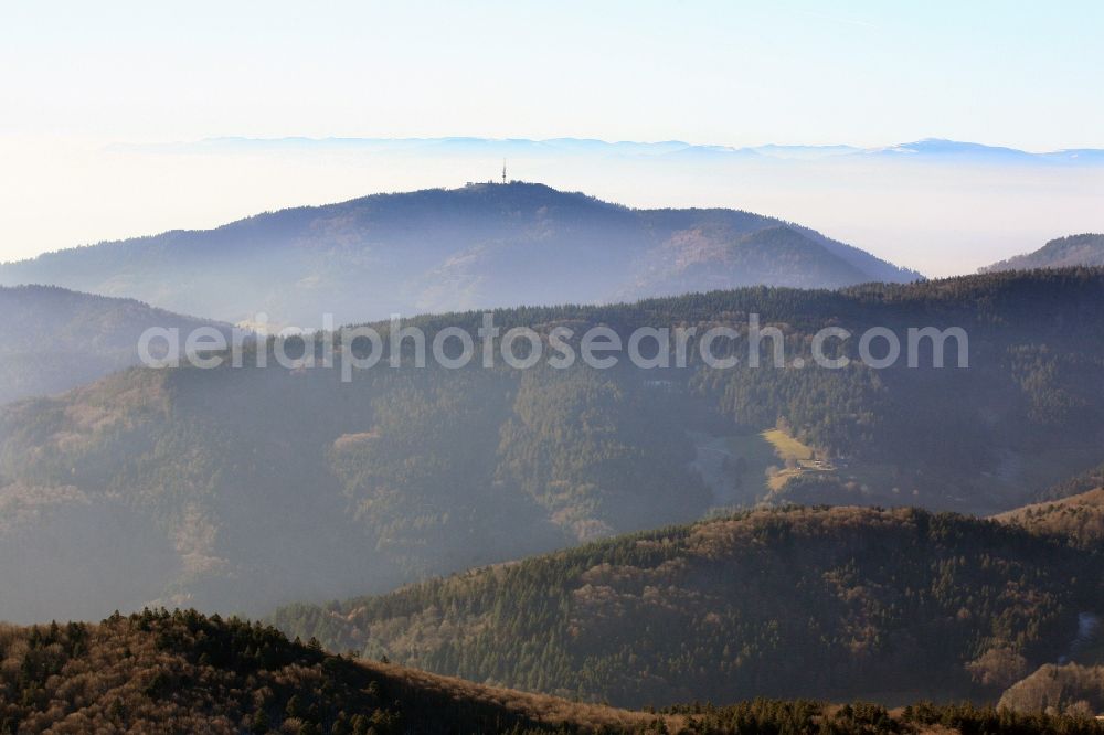 Badenweiler from above - View over the southern Black Forest to the summit of Hochblauen (also called Blauen) at Badenweiler in the state of Baden-Wuerttemberg. The TV Tower in the Black Forest mountain dominate the landscape in the Black Forest. In the background the Vosges Mountains in Alsace