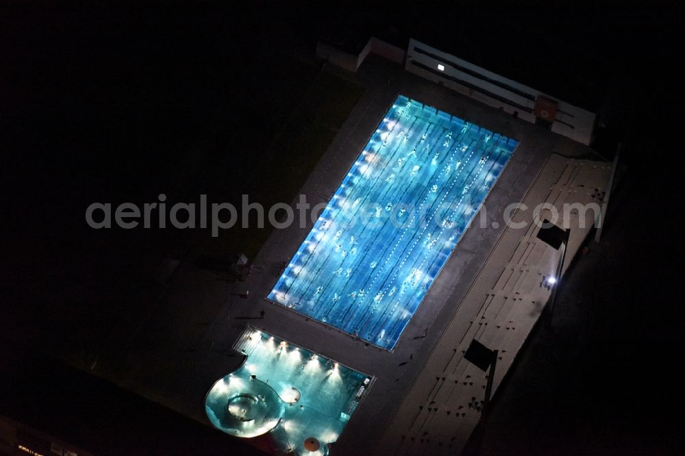 Aerial photograph München - Night view Swimming pool of the Dante-Winter-Warmfreibad an der Postillonstrasse in Munich in the state Bavaria