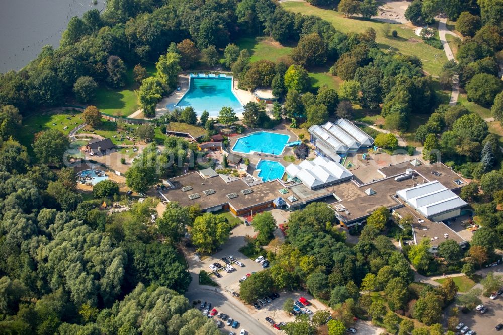 Dortmund from the bird's eye view: Swimming pools of an outdoor swimming pool in the Revierpark Wischlingen in Dortmund in the federal state North Rhine-Westphalia. The park is a green arrangement and recreational arrangement in the Dortmund town district of Huckarde. He lies immediately beside the nature reserve Hallerey