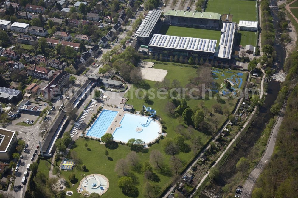 Aerial image Freiburg im Breisgau - Swimming pool of the Strandbad in Freiburg im Breisgau in the state Baden-Wuerttemberg. Behind this the Schwarzwald Stadium of the soccer club SC Freiburg