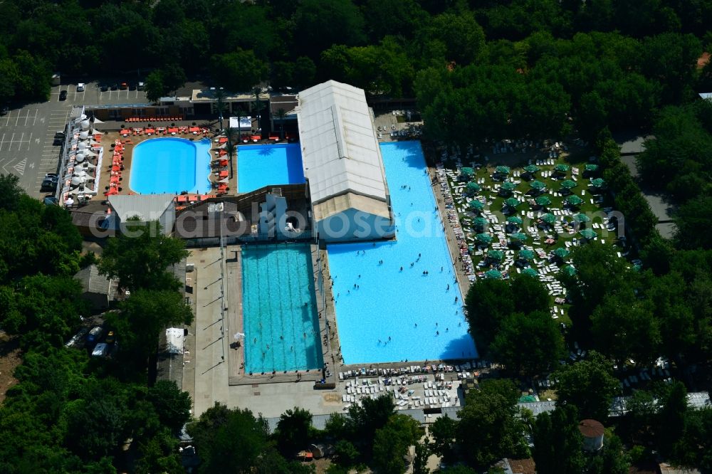 Aerial image Bukarest - Swimming pool and sunbathing at the pool - swimming pool Strandul Tineretului in Bucharest, Romania