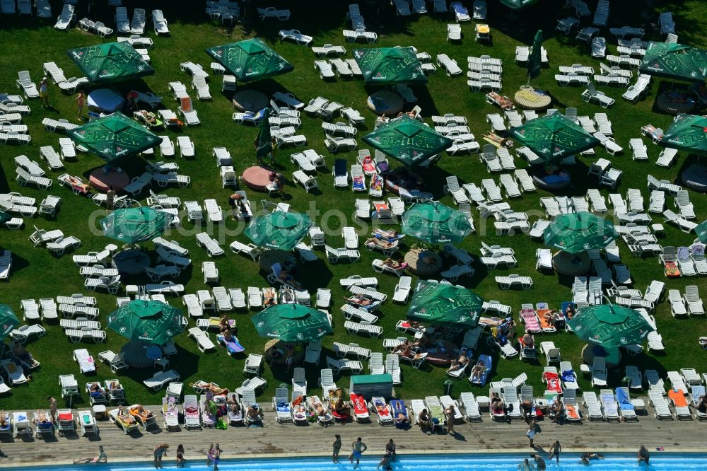 Aerial image Bukarest - Swimming pool and sunbathing at the pool - swimming pool Strandul Tineretului in Bucharest, Romania