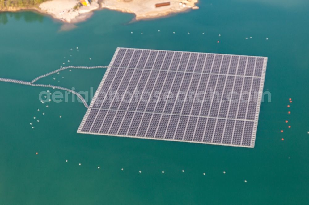 Aerial image Leimersheim - Floating solar power plant and panels of photovoltaic systems on the surface of the water on a quarry pond for gravel extraction in Leimersheim in the state Rhineland-Palatinate, Germany