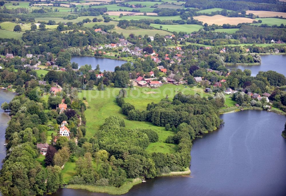 Plön from the bird's eye view: View of the southern bay of the Langensee in Plön in the state Schleswig-Holstein. Except from the Langensee you can see the Suhrer See