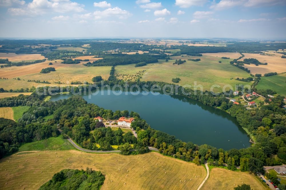 Aerial image Schorssow - Lake Haussee with hotel Seeschloss Schorssow in Schorssow in the state Mecklenburg - Western Pomerania