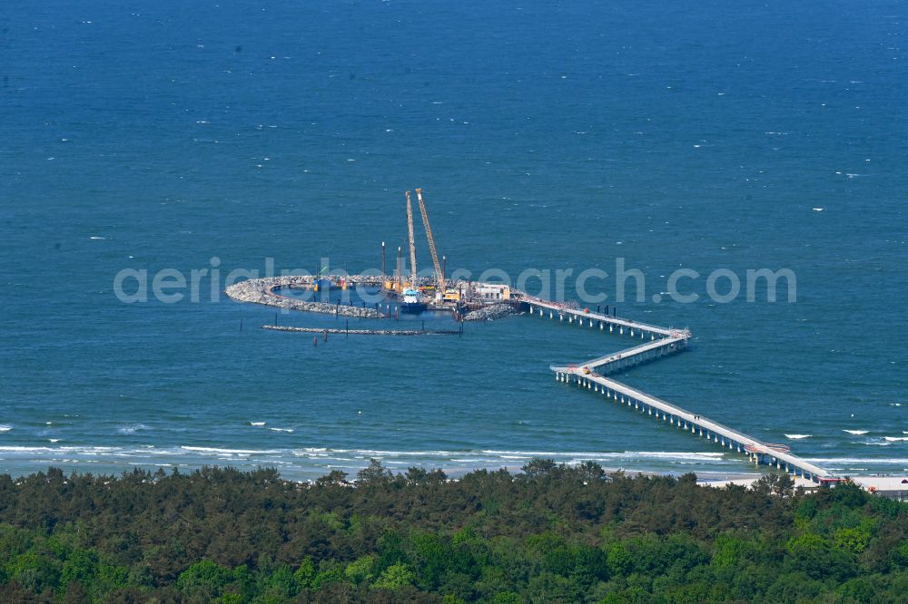 Prerow from above - Construction site for the new construction of a pier for crossing the coastal water and connecting the island port on the Baltic Sea in Prerow in the state Mecklenburg-West Pomerania, Germany