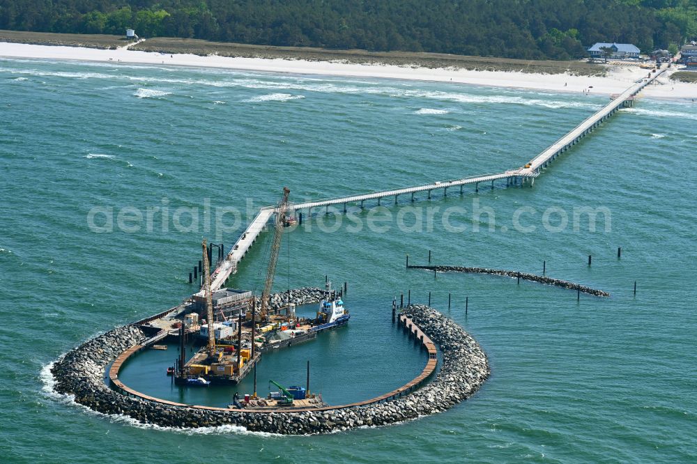 Prerow from above - Construction site for the new construction of a pier for crossing the coastal water and connecting the island port on the Baltic Sea in Prerow in the state Mecklenburg-West Pomerania, Germany