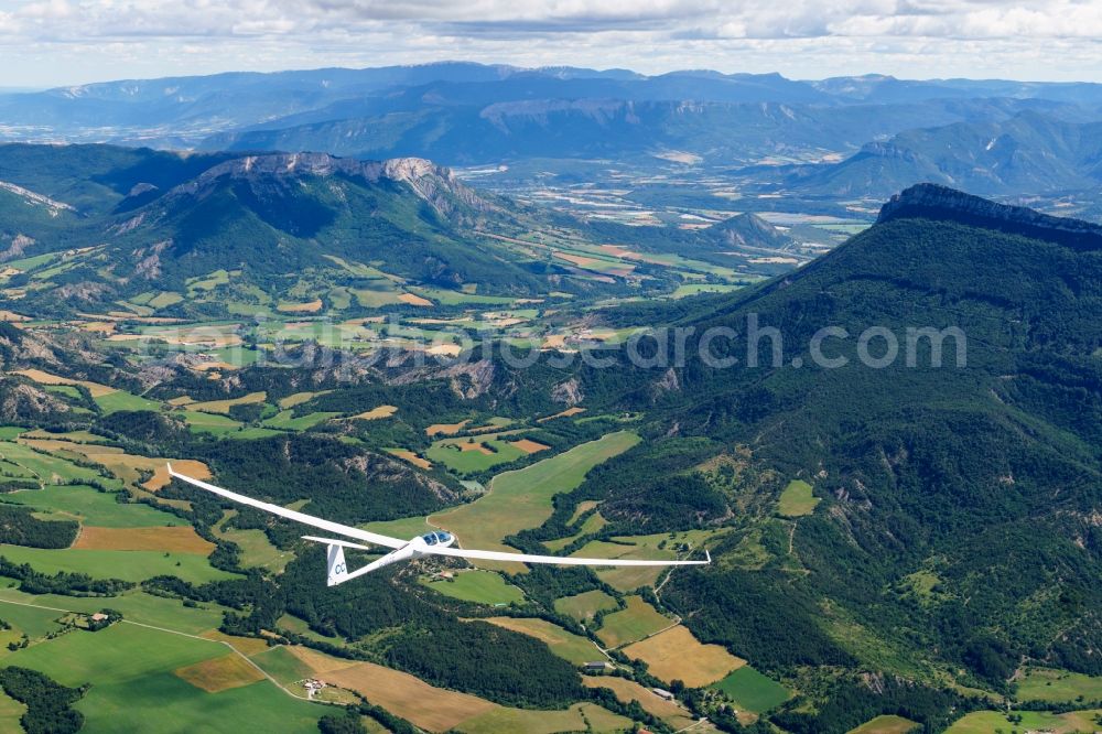 La Faurie from the bird's eye view: Double seater and high performance glider ASH30 flying over the airspace in La Faurie in Provence-Alpes-Cote d'Azur, France