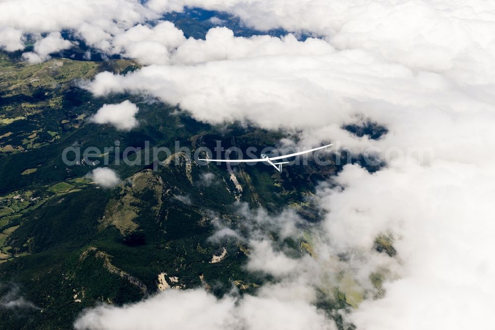 Aerial image La Faurie - Double seater and high performance glider ASH30 flying above the cloud base in La Faurie in Provence-Alpes-Cote d'Azur, France