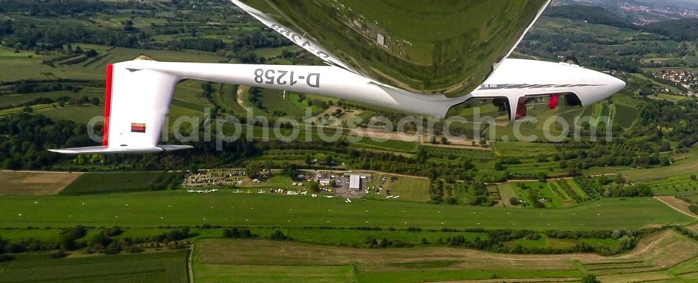 Ettenheim from the bird's eye view: Glider and sport aircraft ASK-21 in Kunstflug flying over the airspace in Ettenheim in the state Baden-Wurttemberg, Germany