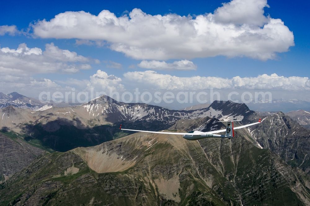 Orcières from above - Glider ASW 20 D-6538 in flight over the rugged peak of the mountain Grande Autanedes in the national park Ecrins in Provence-Alpes-Cote d'Azur, France