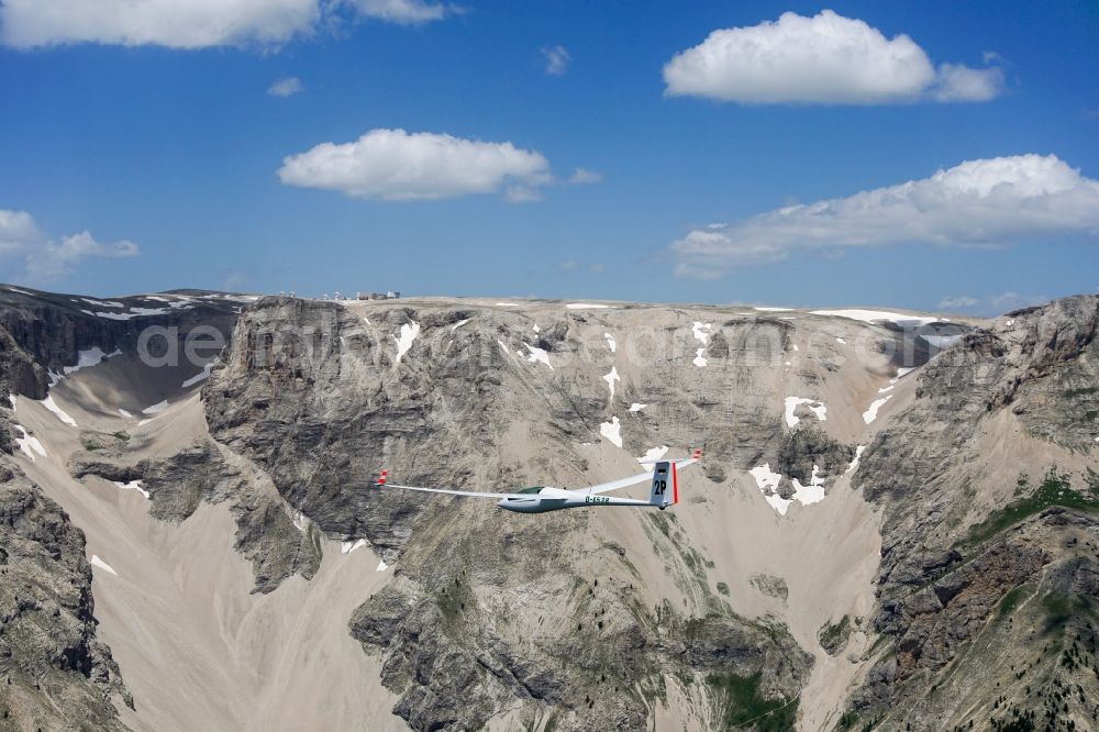 Montmaur from above - Glider ASW 20 D-6538 in flight above the Pic de Bure in the Provence-Alpes-Cote d'Azur, France. The Pic de Bure is a 2709-meter-high mountain in the Devoluy massif