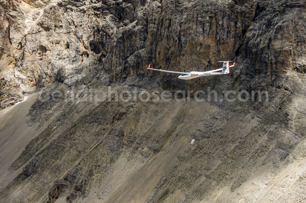 Montmaur from the bird's eye view: Glider ASW 20 D-6538 in flight above the Pic de Bure in the Provence-Alpes-Cote d'Azur, France. The Pic de Bure is a 2709-meter-high mountain in the Devoluy massif