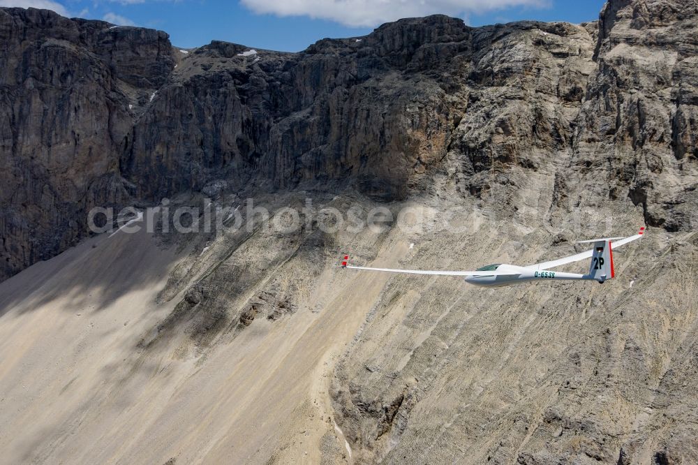 Aerial image Montmaur - Glider ASW 20 D-6538 in flight above the Pic de Bure in the Provence-Alpes-Cote d'Azur, France. The Pic de Bure is a 2709-meter-high mountain in the Devoluy massif