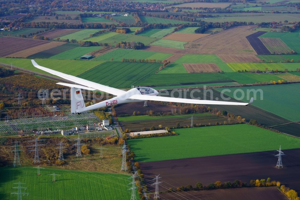 Deinste from above - Glider and sport aircraft LS-4 D-4103 flying over the airspace of the Feerner Moor and a electric transformer station close to Dollern in the state Lower Saxony, Germany