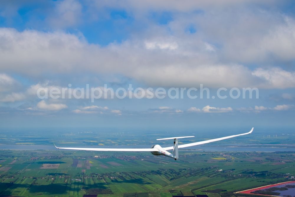 Aerial image Drochtersen - Glider and sport aircraft LS-4 D-4103 flying below cumulus clouds over the airspace of Drochtersen in the state Lower Saxony, Germany
