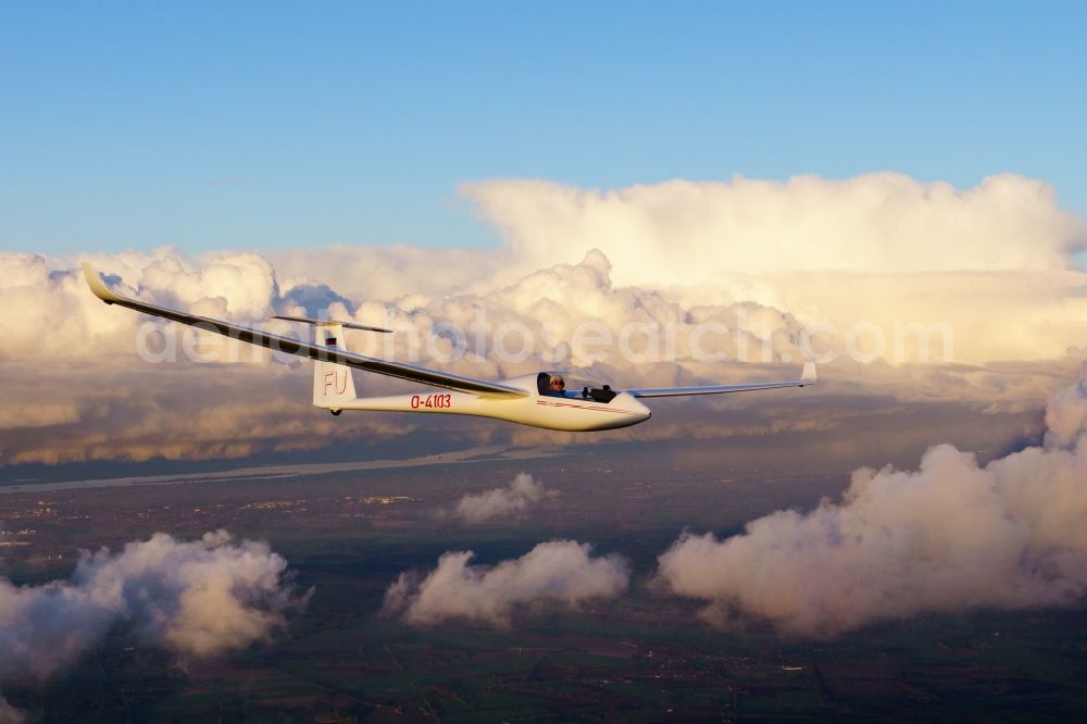 Estorf from above - Glider and sport aircraft LS4 D-4103 flying over the clouds in the airspace of Estorf in the state Lower Saxony, Germany