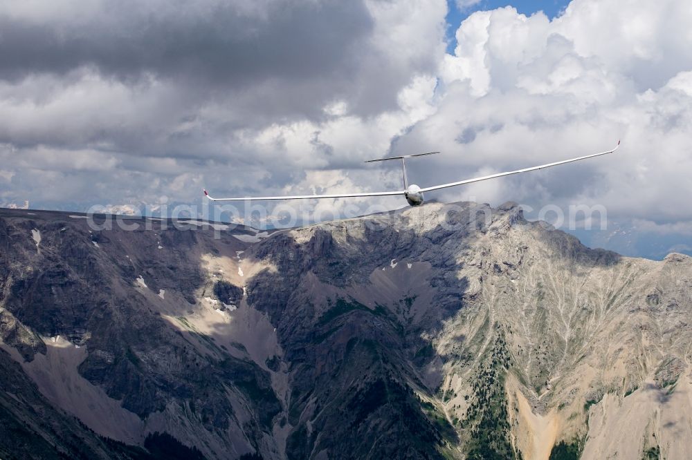 Montmaur from above - Glider and sport airplane LS-8 D-1896 in flight over the 2709m high peak of Pic de Bure at Montmaur in Provence-Alpes-Cote d'Azur, France