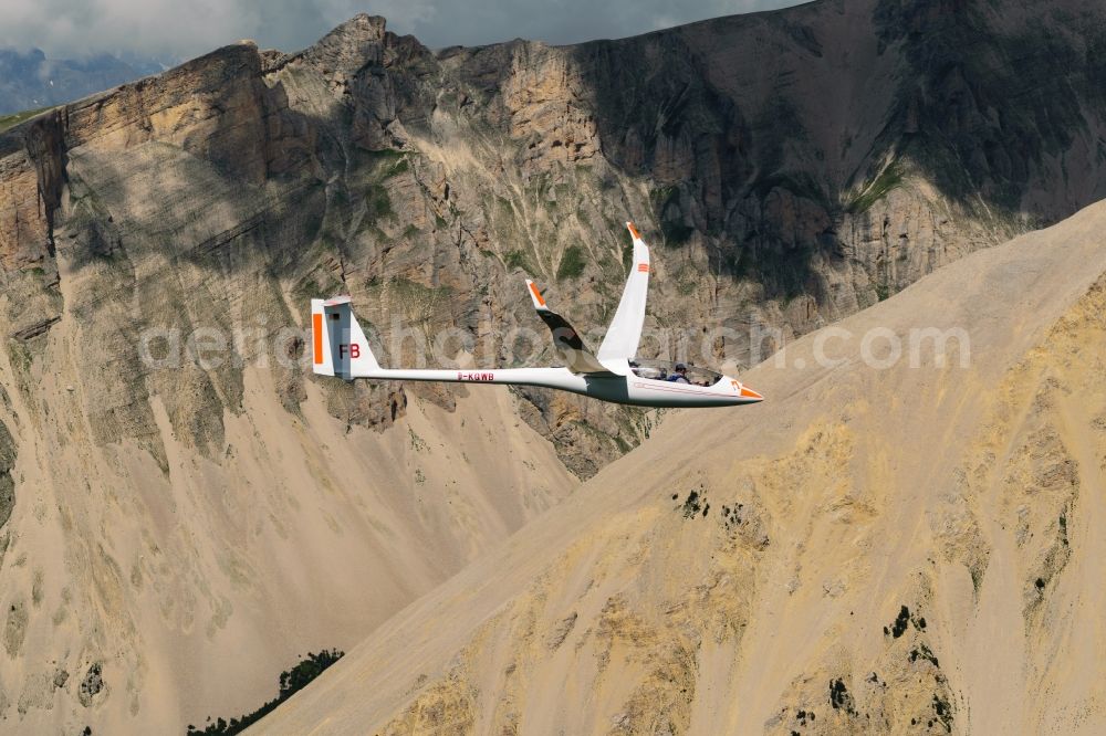 Montmaur from the bird's eye view: Glider EB28 D-KQWB in flight over the mountain Pic de Bure at Montmaur in Provence-Alpes-Cote d'Azur, France. The EB 28 is a double-seated glider of the open class