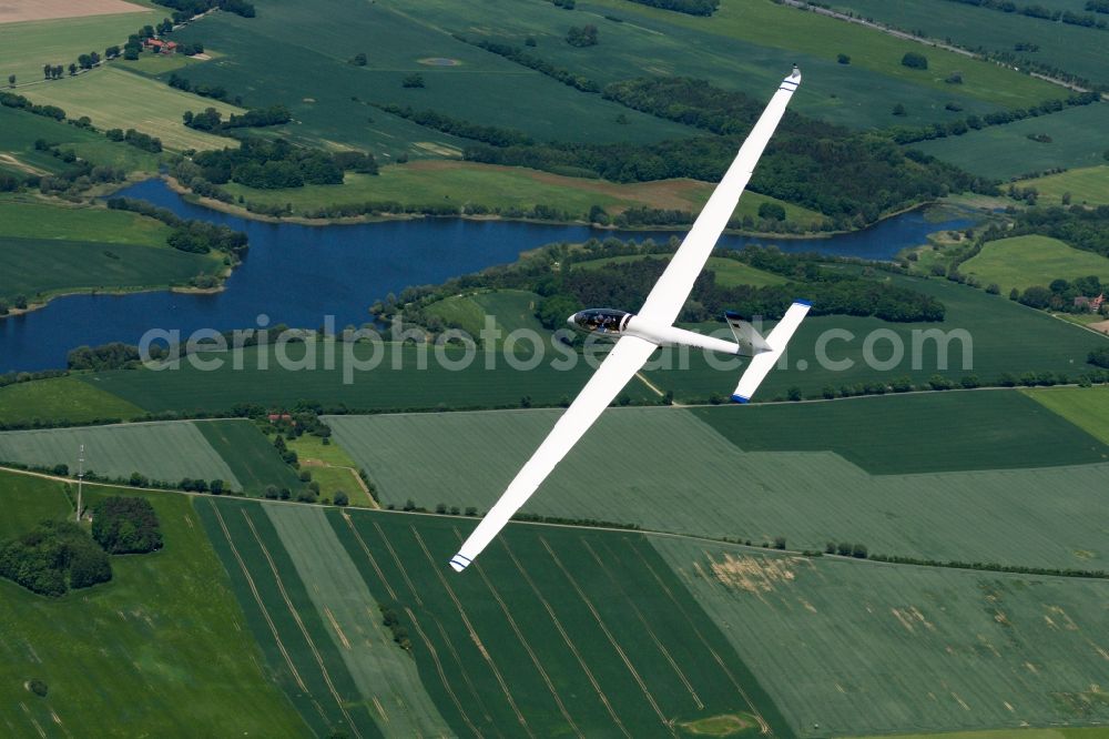 Predöler Stausee from above - Double-seater glider SZD-54 Perkoz flying over the airspace at the Predoeler Swimming Lake in the state Brandenburg, Germany