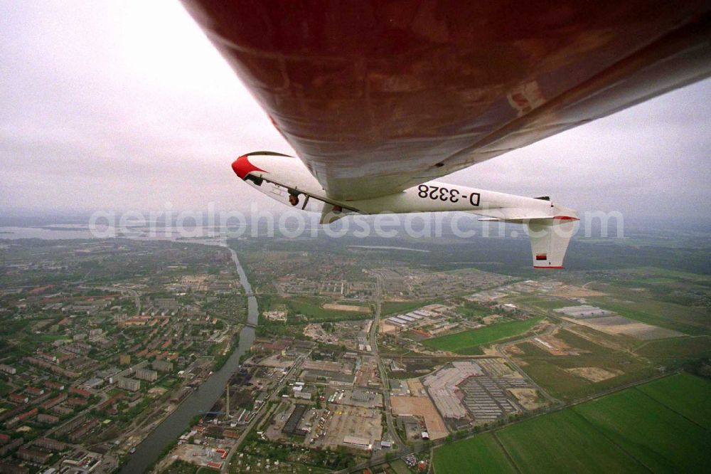 Aerial photograph Brandenburg an der Havel - Glider and sports aircraft PZL Bielsko SZD-9 Bocian with the registration D-3328 in a banked turn in flight over the airspace in Brandenburg an der Havel in the state Brandenburg, Germany