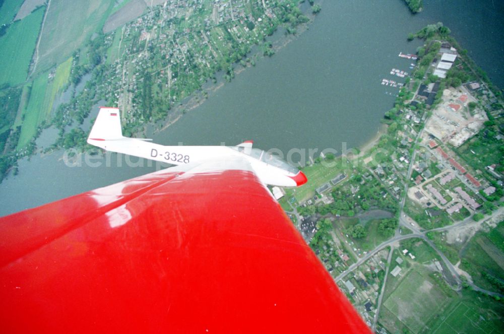 Aerial photograph Brandenburg an der Havel - Glider and sports aircraft PZL Bielsko SZD-9 Bocian with the registration D-3328 in a banked turn in flight over the airspace in Brandenburg an der Havel in the state Brandenburg, Germany