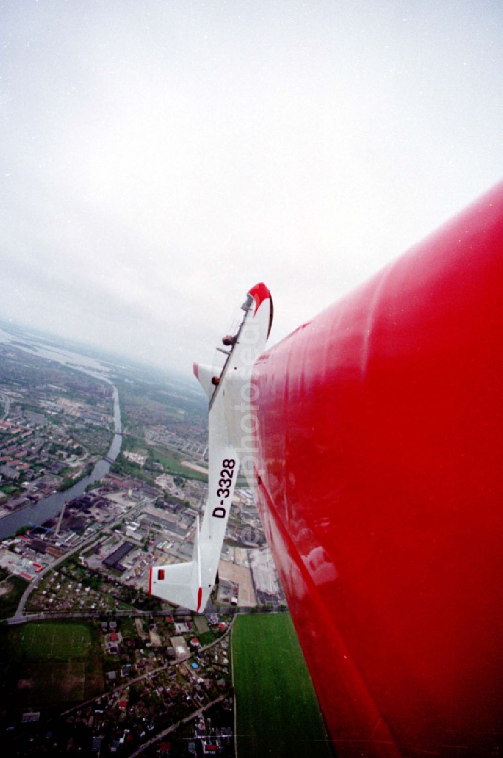 Aerial image Brandenburg an der Havel - Glider and sports aircraft PZL Bielsko SZD-9 Bocian with the registration D-3328 in a banked turn in flight over the airspace in Brandenburg an der Havel in the state Brandenburg, Germany