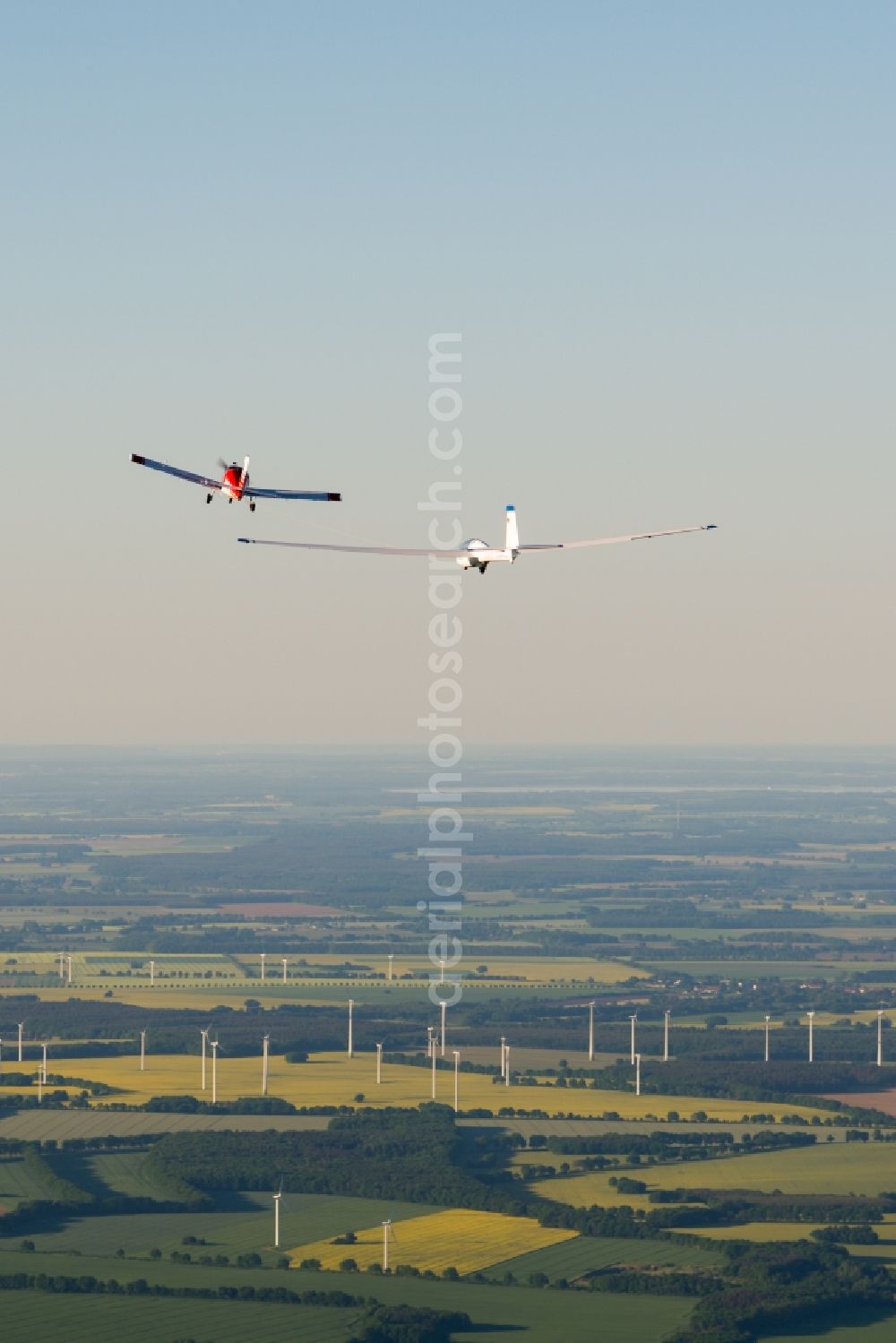 Aerial photograph Pritzwalk - Glider and sport aircraft SZD 54 Perkoz while towing over the airspace in Pritzwalk in the state Brandenburg, Germany