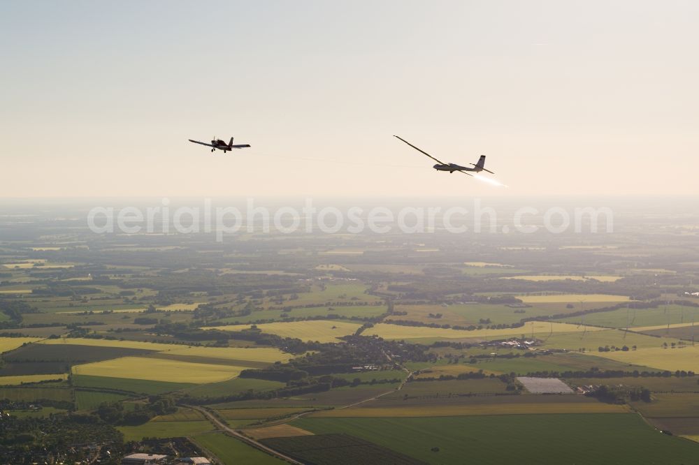 Aerial image Pritzwalk - Glider and sport aircraft SZD 54 Perkoz while towing over the airspace in Pritzwalk in the state Brandenburg, Germany