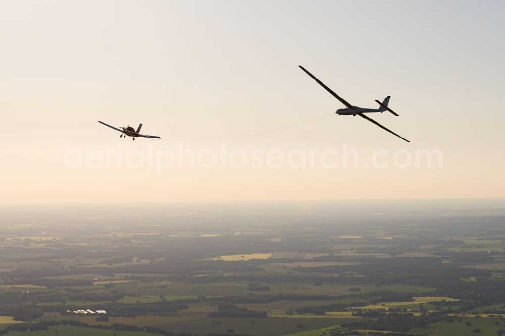 Pritzwalk from above - Glider and sport aircraft SZD 54 Perkoz while towing over the airspace in Pritzwalk in the state Brandenburg, Germany