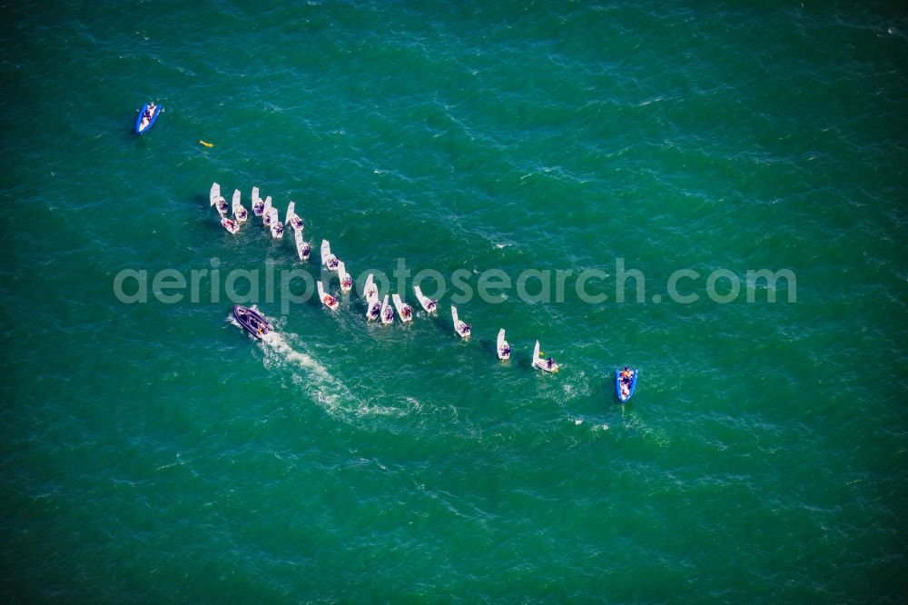 Lübeck from the bird's eye view: Sailing regatta on the Baltic Sea off Travemuende with the boat class Optimist in Luebeck in the state Schleswig-Holstein, Germanyy