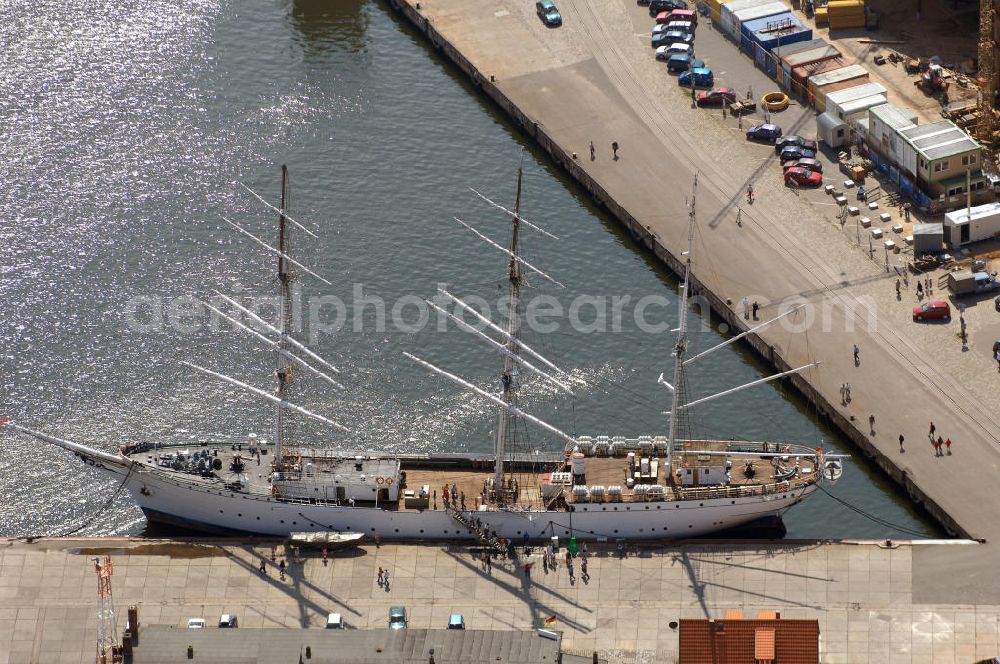 STRALSUND from the bird's eye view: Das Segelschiff Gorch Fock I angelegt an ihrem Heimathafen Stralsund. Bis Ende April 1945 war die bei Blohm+Voss in Hamburg gebaute Gorch Fock in Stralsund beim 1. Schiffsstammregiment als Kadetten-Schulschiff zu Hause. Sie überstand alle Bombenangriffe unbeschadet, bis sie am 30. April 1945 von einem Sprengkommando vor der Hansestadt versenkt wurde. Bis Mitte 1947 rostete das Wrack etwa 150 m südwestlich der rügenschen Halbinsel Drigge vor sich hin. Dann wurde sie geborgen und im Juni 1947schwamm die „Gorch Fock“ wieder. Am 15. Juni 1951 wurde sie nach Reparaturarbeiten unter sowjetische Flagge als „Towarischtsch“ erneut in den Dienst gestellt. Seit dem 25. September 2003 ist die ,,Gorch Fock wieder in ihrem alten Heimathafen zu Hause und zu besichtigen. Adresse: Hafen/Ballastkiste, 18439 Stralsund, Betriebsleitung: Nicole Merten, Bord-Tel:03831 666520, Fax 03831 666519, E-Mail: info@gorchfock1.de; Förderverein Gorch Fock I e.V., Knieperstr. 20, 18439 Stralsund, Tel. 03831 305090, Fax 03831 305063, E-Mail: s.eicke@web.de;