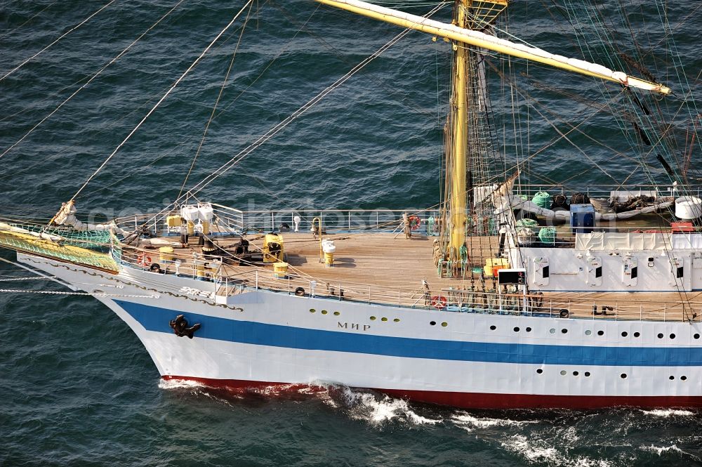 Aerial image Rostock - View of the training ship MIR in the Baltic Sea off Rostock in Mecklenburg Western Pomerania. It is owned by the Admiral Makarov Academy in Saint Petersburg, was built in the Lenin shipyard in Danzig and is considered one of the fastest tall ships in the world