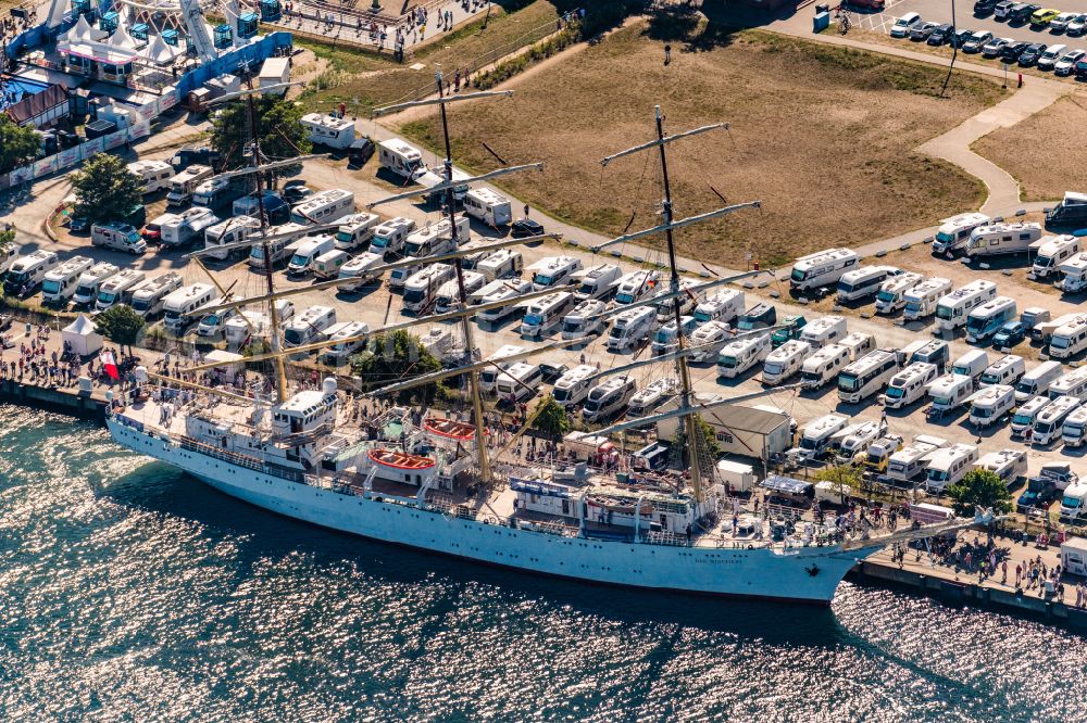 Aerial photograph Rostock - Sailing ship Polish sailing training ship Dar Modziey in the port of Rostock Warnemuende for the Hansesail 2022 in the state Mecklenburg - Western Pomerania, Germany