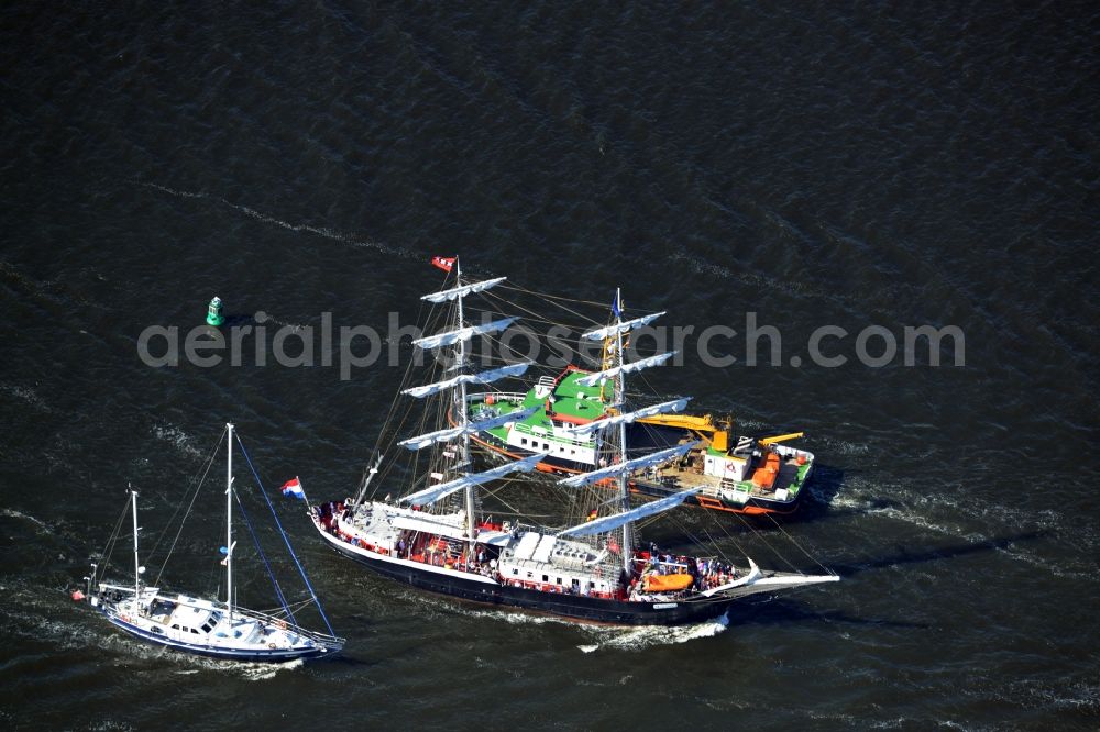 Aerial photograph Rostock - Sailboat underway on the Unterwarnow in Rostock in the state Mecklenburg - Western Pomerania