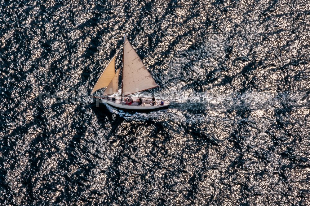 Glücksburg from above - Sailing yacht in motion on the Flensburg Fjord in Gluecksburg in the state Schleswig-Holstein, Germany