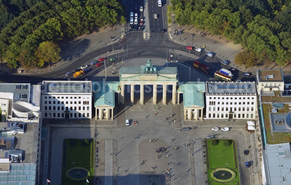 Aerial image Berlin - View of the Brandenburg Gate in Berlin at the Pariser Platz in Berlin. To the left of the Brandenburg Gate is the Commerzbank, the U.S. Embrassy, the DZ Bank, the Academy of Art Berlin and the Hotel Adlon. To the right of the Brandenburg Gate is the Haus Liebermann, the Palais am Pariser Platz, the Eugen-Gutmann-Haus used by Dresdner Bank, the French Embrassy and the Kennedy Museum. Behind the Brandenburg Gate, you can see a part of the urban public park Tiergarten